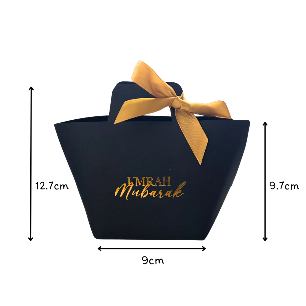 Black bag with gold ribbon and 'Umrah Mubarak' text, shown with measurements on a white background.