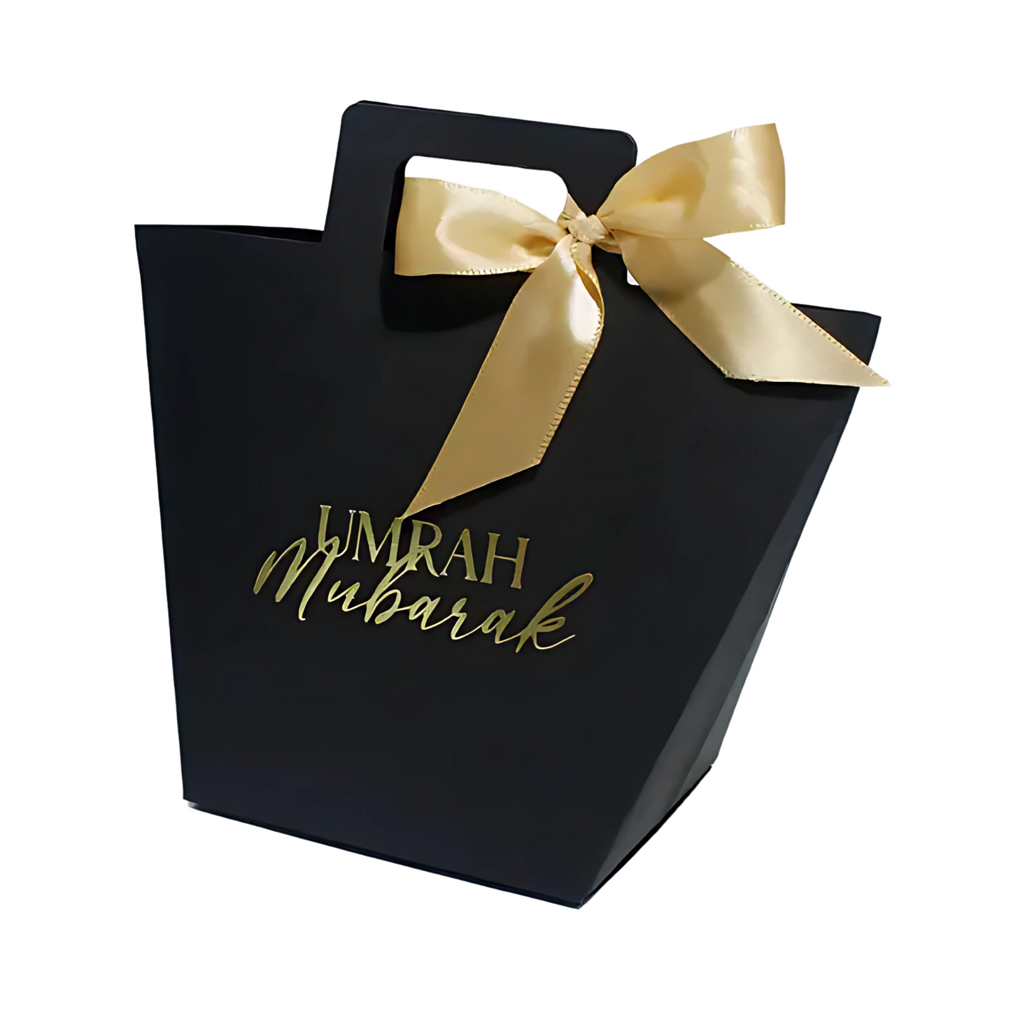 Black gift bag with gold ribbon and 'Umrah Mubarak' text on a white background