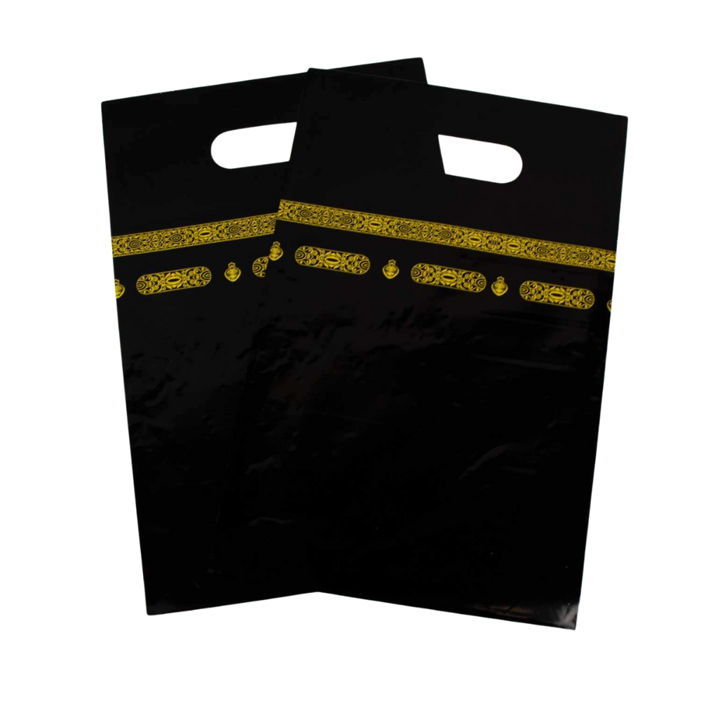 Two black plastic bags with gold decorative bands on a white background