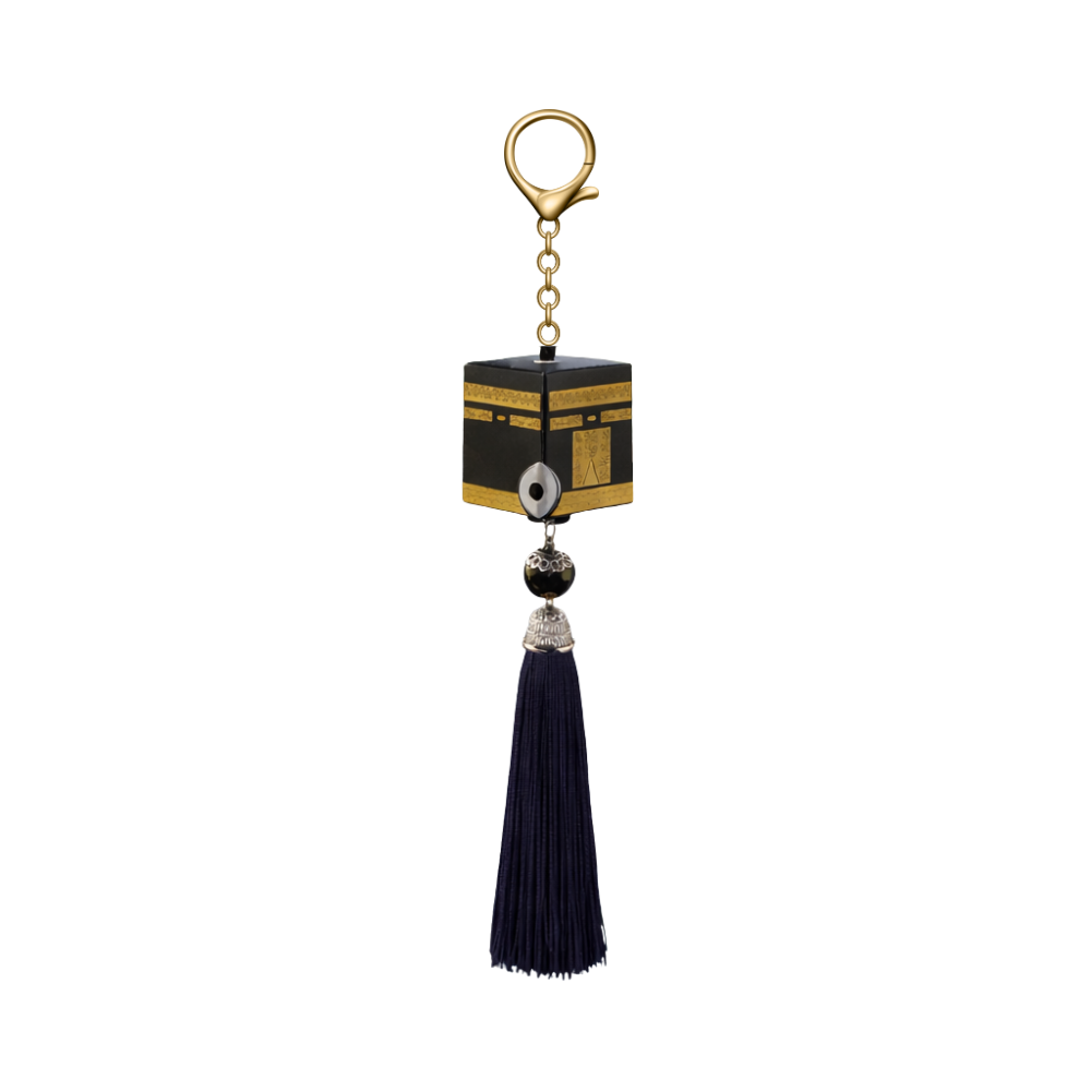 Keychain with black cube design and tassel on a white background