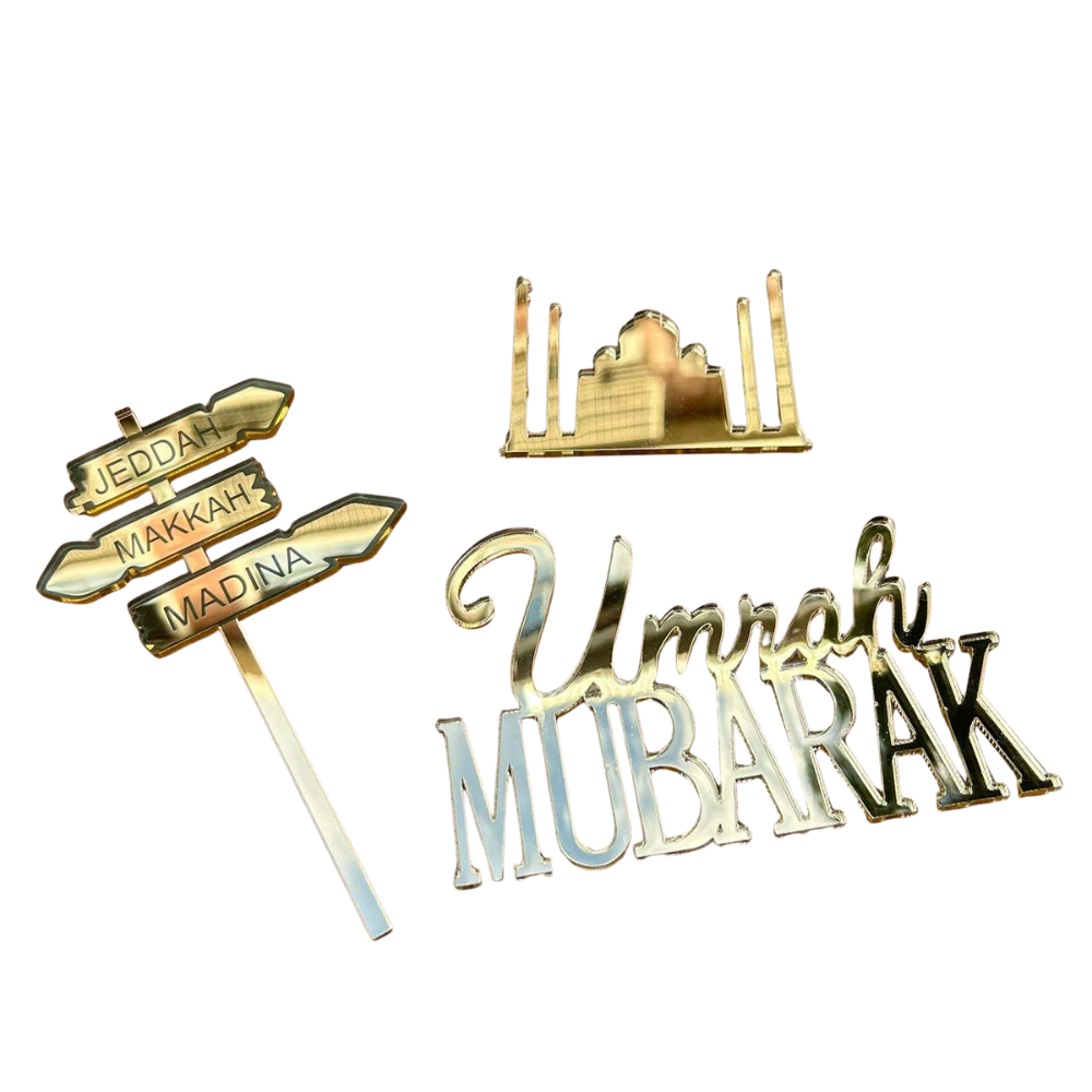 Gold-colored religious symbols and text  cake toppers on a white background